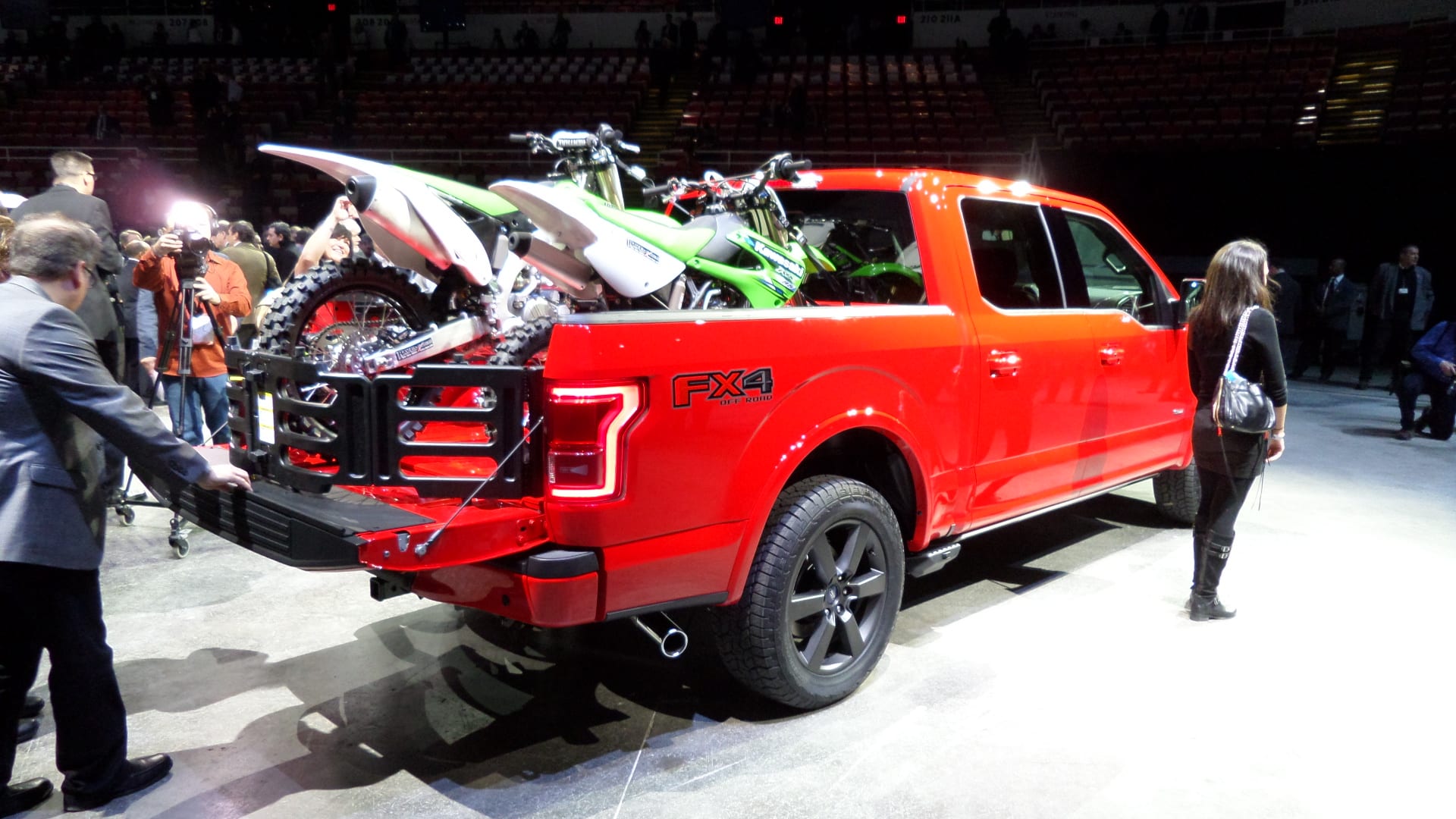Red 2015 Ford F-150. Side view.