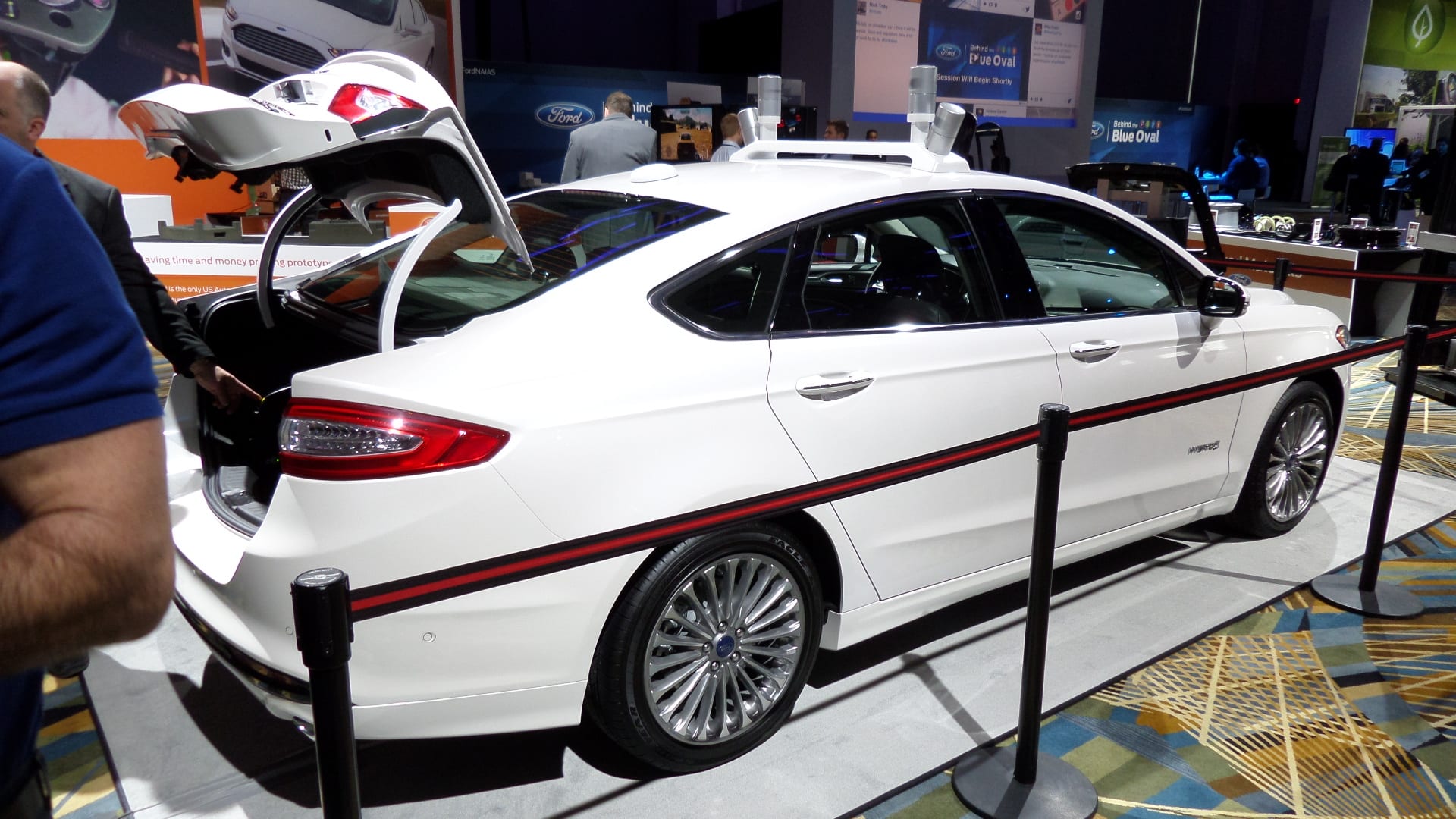 White 2014 Ford Fusion Automated Research Vehicle. Side view.