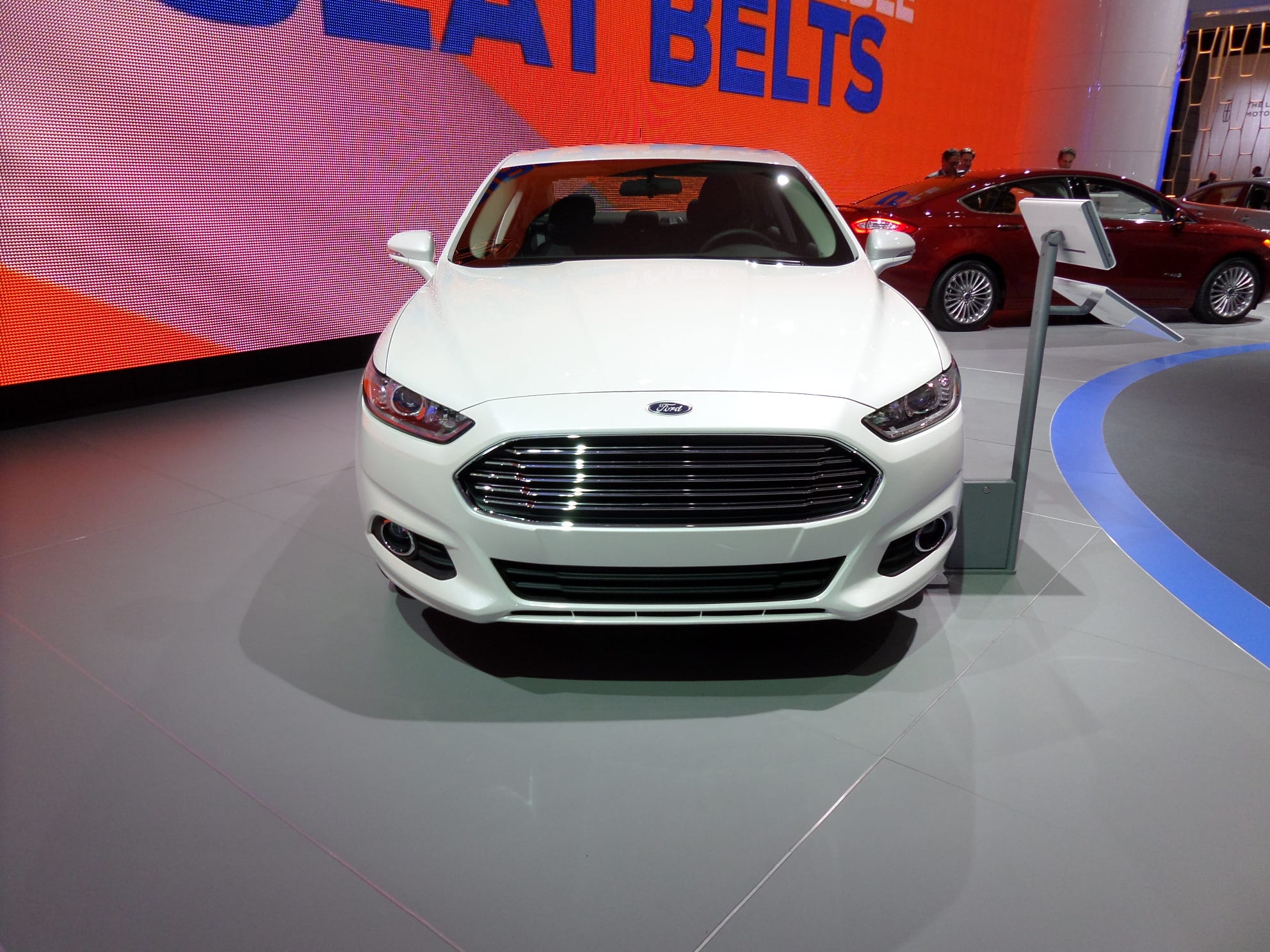 White 2014 Ford Fusion. Front view.