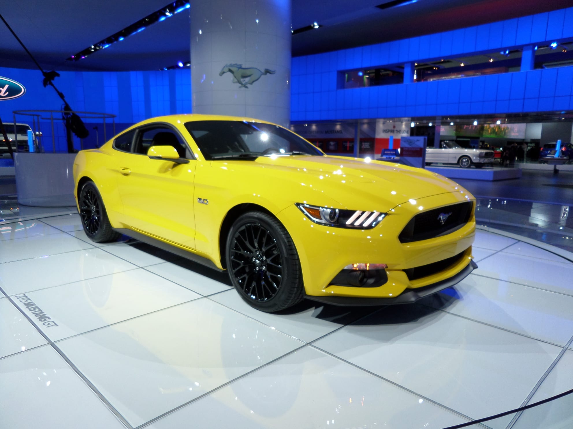 Yellow 2015 Ford Mustang. A mid-sized sports car