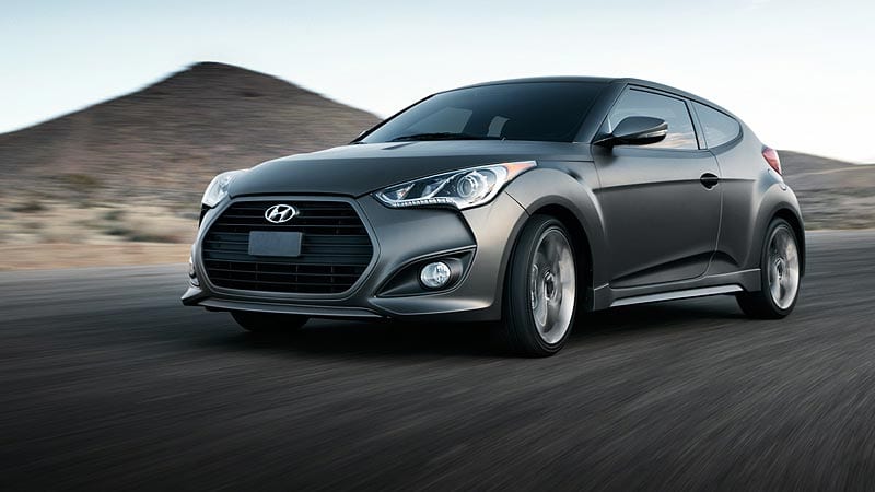 Hyundai Veloster. This is a highly efficient and cheap sports car