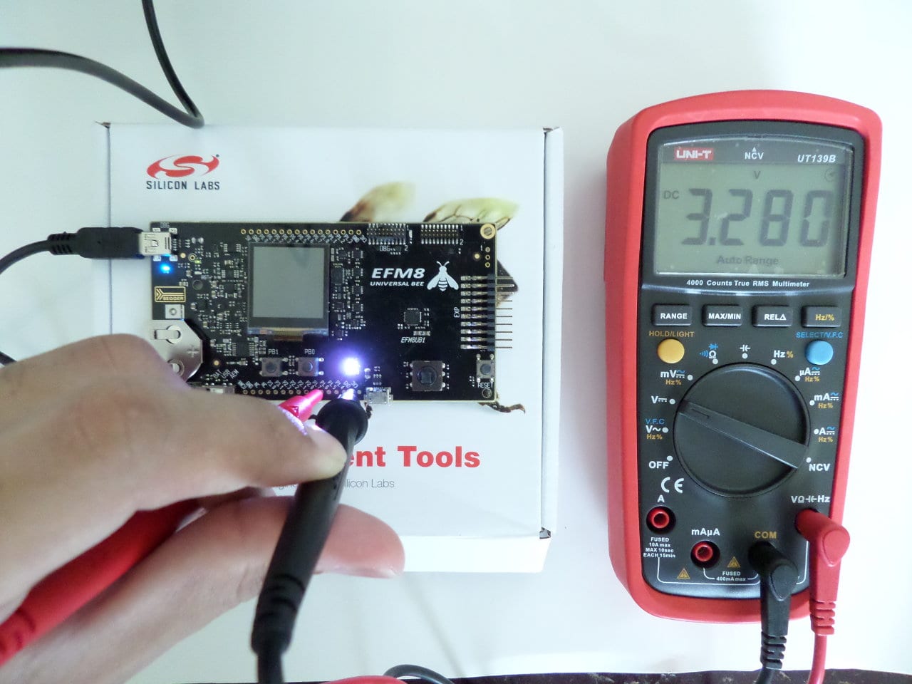 Me checking the EFM8 pins using a True RMS multimeter.