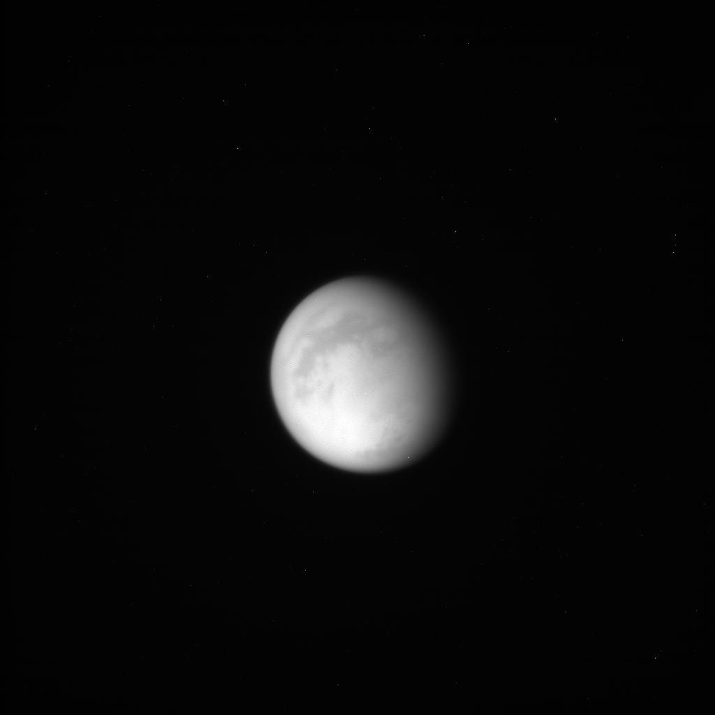 A raw image of Titan, one of Saturn's moons.
